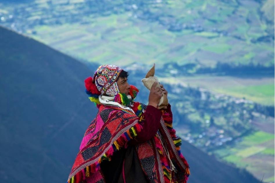 A Q’ero Paqo asks the Apu spirits to bless a mesa in an offering ceremony in Peru. 
