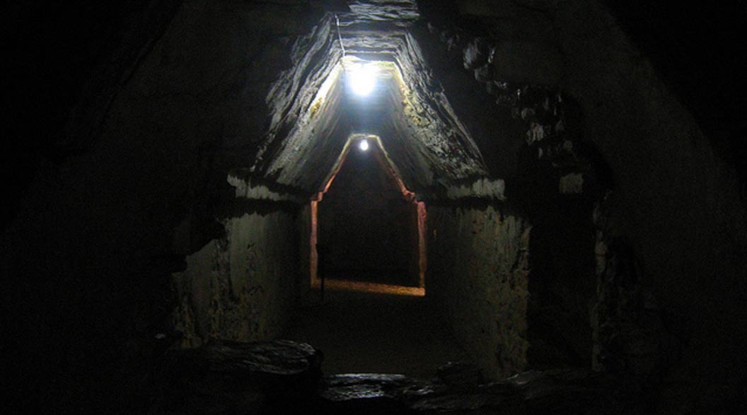Caves were seen as entrances into the mysterious Underworld. A dark tunnel leading into a chamber at Palenque, Mexico. 