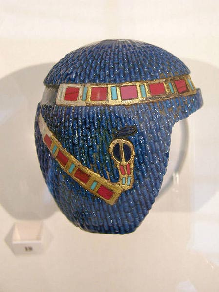 Piece representing an 19th Dynasty Egyptian wig with diadem.