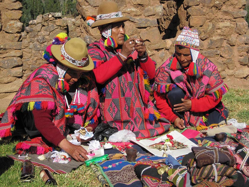 Q’ero spiritual leaders preparing items for offering ceremonies in Pisac, Peru. 