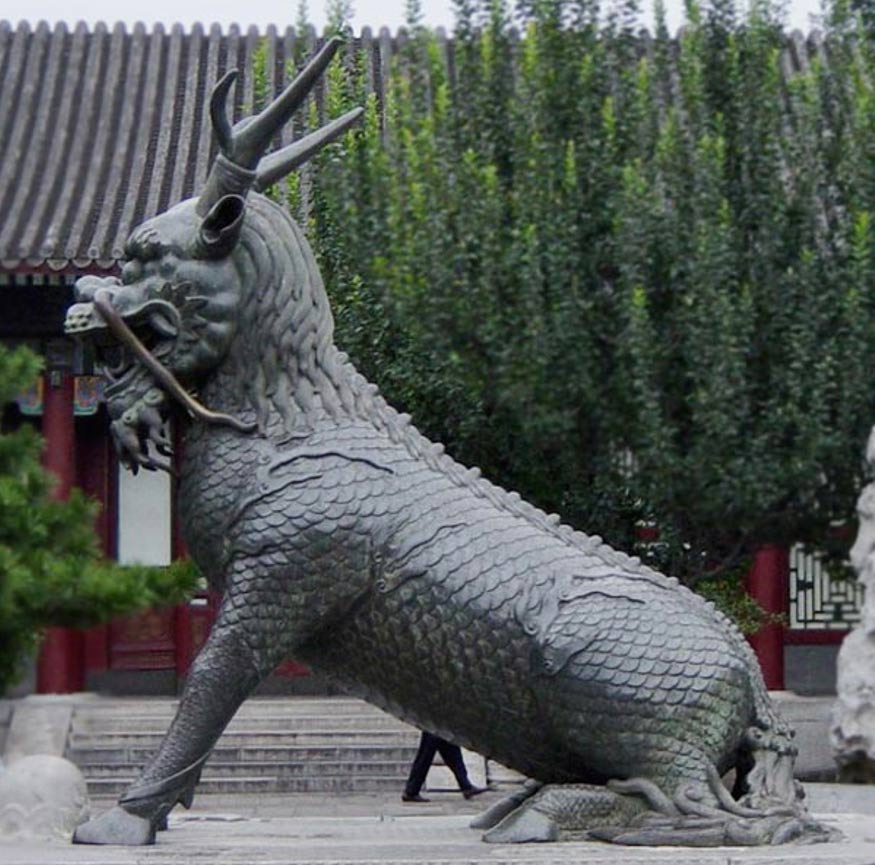 Qing dynasty statue of Qilin. Summer Palace, Beijing, China. Note the scale body and two horns. 