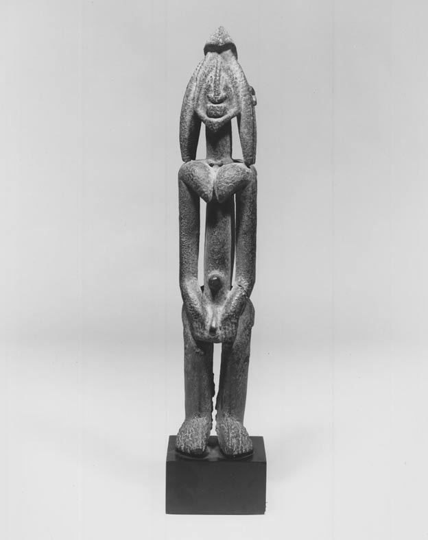 Figures like this one were placed on ancestral altars as links to a deceased person's soul. It is likely that this figure represents a Nommo, one of the first created beings, who, according to Dogon mythology, had a combination of male and female traits.