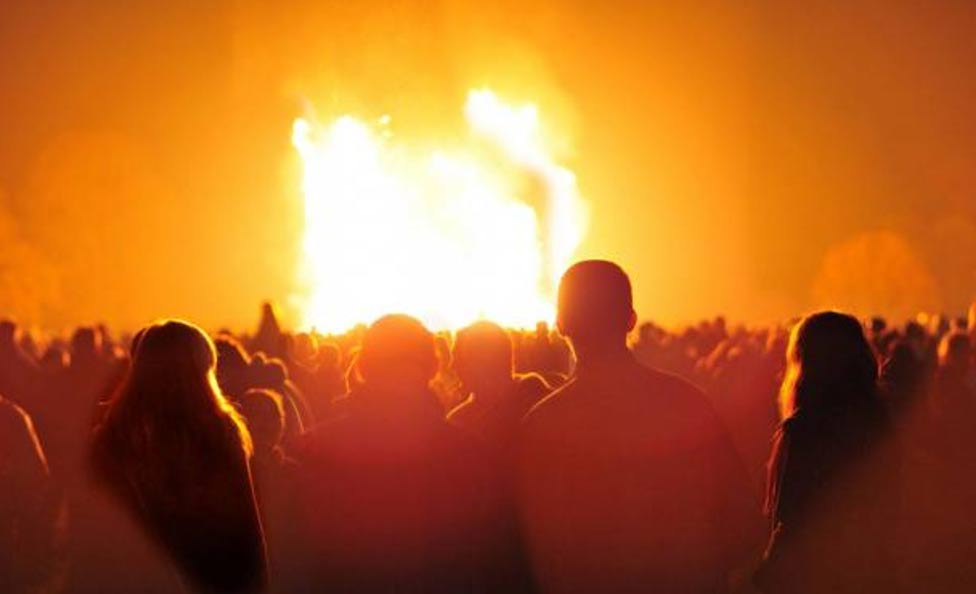 Spectators gather around a bonfire November 2010, Staffordshire, England.